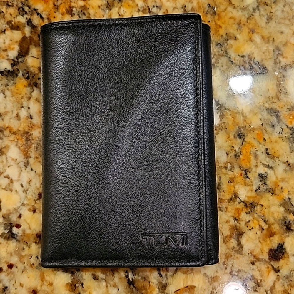 Black Tumi Leather Tri-fold wallet